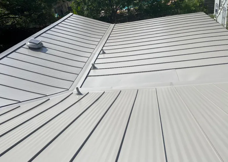 Solar attic fan installed on a metal roof for Roof Ventilation in Rapid City